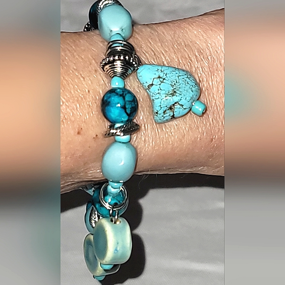 Shades of aqua and turquoise and silver stretch bracelet.